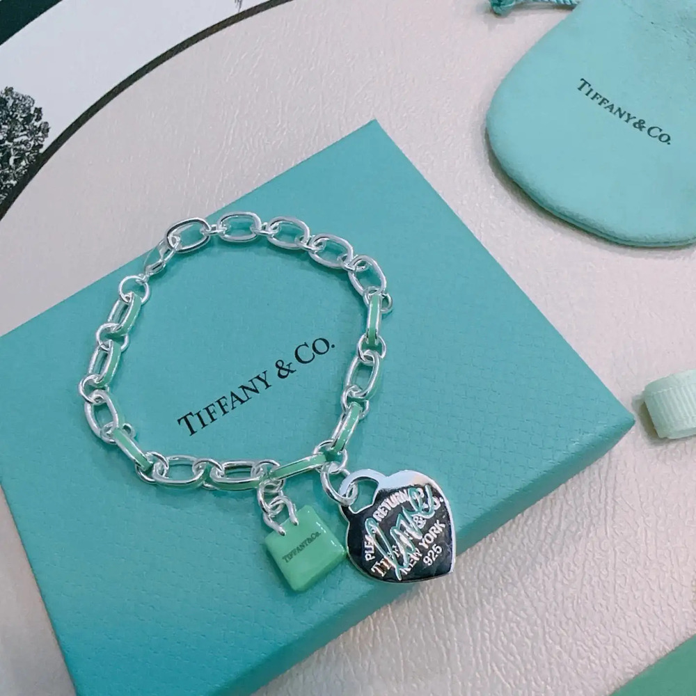 Tiffany & Co. silver-green color scheme with heart-shaped bracelet